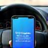 Smartphone with Telegram traffic alert open in car